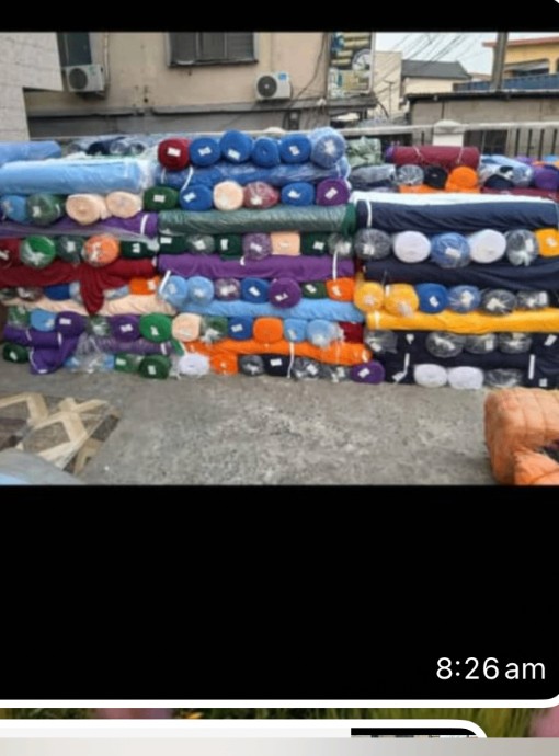 Stacks of assorted fabric bales ready for distribution
