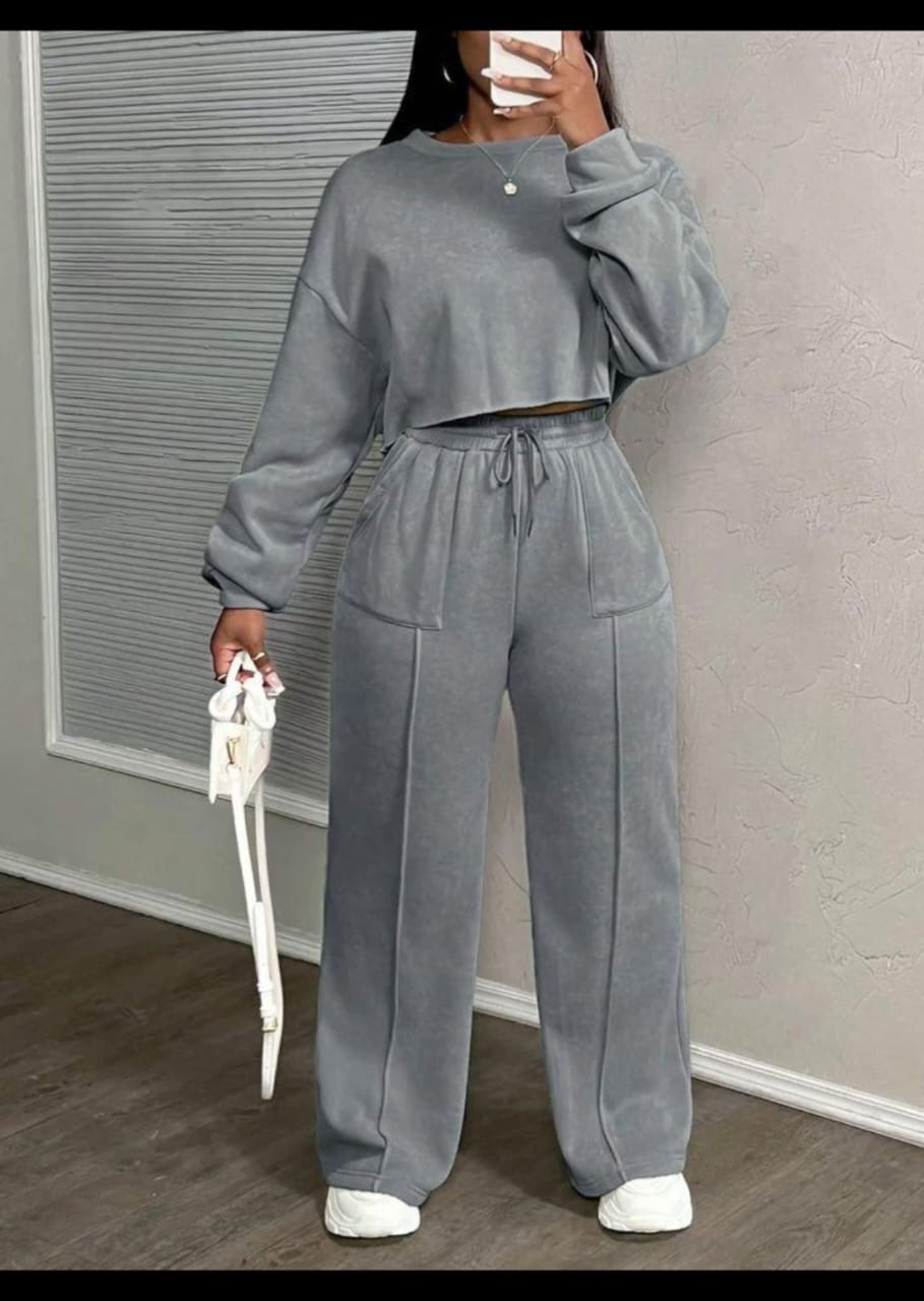 Woman wearing a grey two-piece sweat loungewear set
